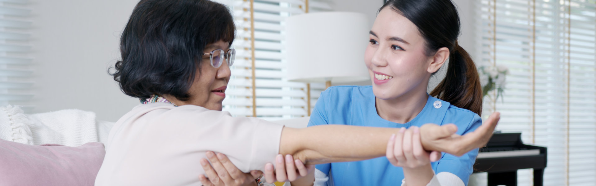 Caregiver massaging hands